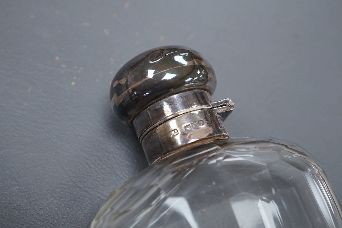 A George V silver mounted glass hip flask, with cup base, by Mappin & Webb, London, 1912, 15.8cm.